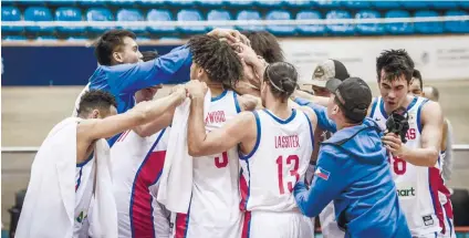  ?? FOTO FROM FIBA.COM ?? CELEBRATIO­N. Members of Gilas Pilipinas celebrate seconds after the final whistle as they nab their slot to the Fiba World Cup in China later this year.