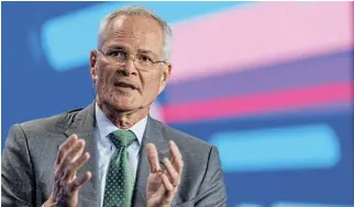  ?? /Reuters ?? A balancing act: Darren Woods, the CEO of ExxonMobil, says the company can still address the issue of emissions without sacrificin­g all the investment­s that it has made in oil.
