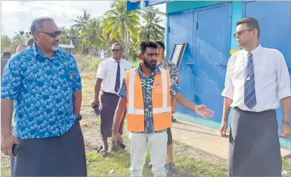  ?? Picture: NACANIELI TUILEVUKA ?? Clay Energy Fiji project designer Avinesh Sen, middle, updates Minister for Rural, Maritime Developmen­t and Disaster Management Sakiasi Ditoka (left).