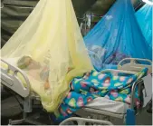  ?? MARTIN MEJIA/AP ?? Patients suffering from dengue lie in beds June 3 at the Health Ministry in Piura, Peru.