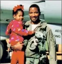  ??  ?? REAL HERO: Navy captain Marco Cromartie, with his daughter in front of a Tomcat, landed a role as an extra in “Top Gun.”