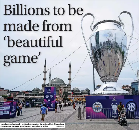  ?? Martin Rickett ?? > A giant replica trophy in Istanbul ahead of Saturday’s Uefa Champions League final between Manchester City and Inter Milan