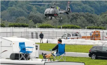  ?? THE ASSOCIATED PRESS ?? A medical helicopter takes off from the infield to take injured driver Robert Wickens to the hospital during the IndyCar race at Pocono Raceway on Sunday in Long Pond, Pa.