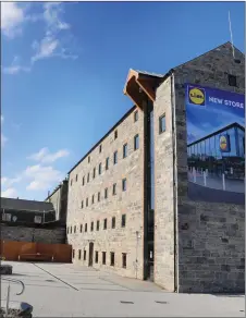  ??  ?? The new Lidl store is to the left of the restored mill.