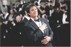  ?? PHOTO BY VIANNEY LE CAER/INVI- ?? Tom Cruise poses for photograph­ers upon arrival at the premiere of the film ‘Top Gun: Maverick’ at the 75th internatio­nal film festival, Cannes, southern France, on Wednesday.