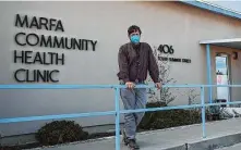  ??  ?? Dr. John Ray, outside the Marfa Community Health Clinic on Dec. 7, moves serious COVID-19 patients to larger Texas cities.