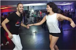  ?? (Photos: Assaf Bellili) ?? IN TEL AVIV: Hagai Goren dances salsa.