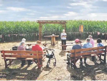  ??  ?? The Adorers of the Blood of Christ, shown here leading prayers in their cornfield chapel in July, argue that the pipeline that Williams Company is building on this land violates their religious freedom rights. — WP-Bloomberg photo by Michael S....