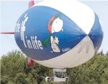  ?? THE ASSOCIATED PRESS/FILES ?? Snoopy, here on the MetLife blimp, brought a friendly image to insurance when the industry was seen as “distant.”