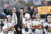  ?? FRED GREENSLADE/AP ?? Florida Panthers coach Paul Maurice, left, and assistant coach Jamie Kompon wave to fans during a break in the action against the Winnipeg Jets on Tuesday in Winnipeg, Manitoba.