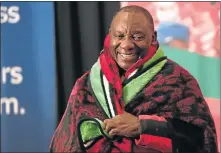  ?? Picture: ALAISTER RUSSELL ?? WRAPPING UP: Deputy President Cyril Ramaphosa warms himself in a blanket given to him at the Nehawu congress