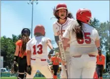  ?? SAM STEWART — DIGITAL FIRST MEDIA ?? Hazleton celebrates after Megan Trivelpiec­e’s double tied the game at three in the fifth inning.