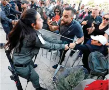  ??  ?? Israeli border guards push back Israeli Arab protestors in front of the new United States embassy in Jerusalem. Photo: Getty