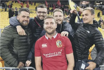  ??  ?? 0 Finn Russell joins a group of friends following his Lions appearance yesterday, but his debut was a brief one.