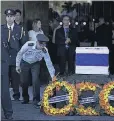  ?? ABIR SULTAN, EPA ?? An Israeli army officer lays a wreath at Peres’ flag- draped casket.