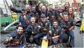  ?? THOMPSON Picture: GETTY IMAGES/MARK ?? BREAKING RECORDS: Race winner Max Verstappen of the Netherland­s and Oracle Red Bull Racing celebrates with his team after the F1 Grand Prix of Monaco on Sunday in Monte Carlo.