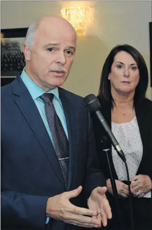  ?? JOE GIBBONS/THE TELEGRAM ?? Finance Minister Tom Osborne and Natural Resources Minister Siobhan Coady speak to reporters about the Newfoundla­nd and Labrador’s carbon tax plan outside the House of Assembly in St. John’s Tuesday.