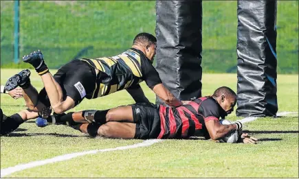  ?? Picture: WERNER HILLS ?? IT’S A TRY: EP Kings player Siyanda Grey dives over for a try in their Currie Cup rugby match against Boland at the Wolfson Stadium in Kwazakhele on Saturday