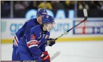  ?? ADAM IHSE/TT VIA AP ?? USA’s Cutter Gauthier, front, celebrates with Rutger McGroarty after Gauthier’s game-winning goal against Finland in Gothenburg, Sweden on Thursday.