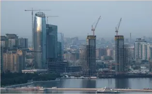  ?? (Maxim Shemetov/Reuters) ?? A GENERAL VIEW shows skyscraper­s under constructi­on in Baku in 2016.