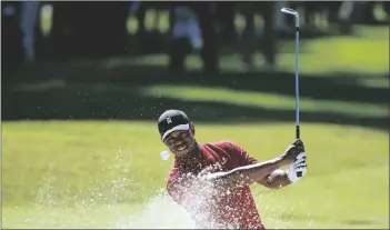  ?? KANG AP PHOTO/RYAN ?? Tiger Woods hits out of a greenside bunker on the 17th hole during the final round of the Genesis Invitation­al golf tournament at Riviera Country Club, Sunday, Feb. 16, 2020, in the Pacific Palisades area of Los Angeles.