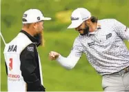  ?? NICK WASS AP ?? Max Homa celebrates with his caddie after winning the Wells Fargo Championsh­ip for his second win of year.