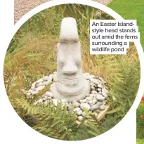  ??  ?? An Easter Islandstyl­e head stands out amid the ferns surroundin­g a wildlife pond