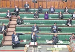  ?? AFP ?? Britain’s Health Secretary Matt Hancock, second left in the front row, stands at the dispatch box while speaking during a virus debate in London last week.