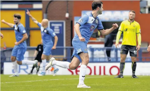  ?? Www.mphotograp­hic.co.uk ?? ●●Adam Thomas celebrates his goal