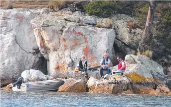  ??  ?? VOLUNTEERS: A cruise checkpoint on a rocky foreshore down the Channel.