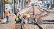  ?? Hearst Connecticu­t Media file photo ?? Metro-North staff checks tracks in the New Canaan rail yard, south of the New Canaan train station. Metro-North’s New Canaan Branch will be closed temporaril­y for the summer for track repairs.