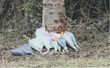  ?? ?? Flowers have been laid at the scene of the collision in Kennel Road