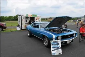  ?? MARIAN DENNIS — DIGITAL FIRST MEDIA ?? A 1969 Chevrolet Camaro S.S. is on display at the Pottstown Municipal Airport for the Eastwood Summer Classic Saturday.