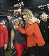  ?? JULIO CORTEZ – THE ASSOCIATED PRESS ?? Chiefs tight end Travis Kelce and girlfriend Taylor Swift walk together after Sunday’s AFC Championsh­ip Game.