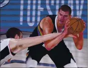  ?? MARK J. TERRILL — THE ASSOCIATED PRESS ?? The Clippers’ Ivica Zubac, left, and the Nuggets’ Nikola Jokic face off one more time tonight in Game 7 of the Western Conference semifinals.