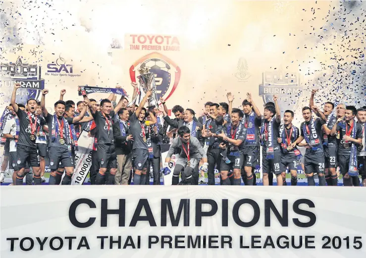  ??  ?? Buriram United celebrate with the Thai Premier League trophy at I-Mobile Stadium.