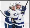  ?? (AP/The Canadian Press/Jason Franson) ?? Ondrej Palat (right) of the Tampa Bay Lightning celebrates his goal with teammate Brayden Point during the Lightning’s victory over the Dallas Stars on Wednesday night in Game 3 of the Stanley Cup Final.