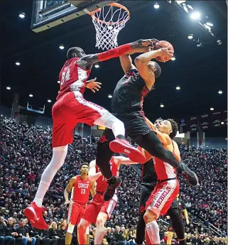  ?? KENT HORNER — GETTY IMAGES ?? San Diego State’s Matt Mitchell goes to the basket against UNLV’S Cheikh Coleman, left, on Saturday.