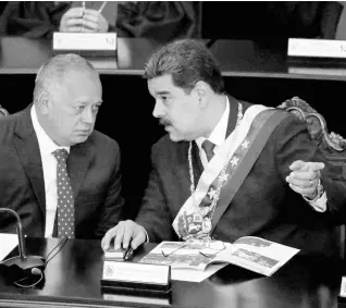  ?? AP ?? In this January 2019 file photo, Venezuelan President Nicolas Maduro (right), speaks with Constituti­onal Assembly President Diosdado Cabello at the Supreme Court during an annual ceremony that marks the start of the judicial year in Caracas, Venezuela.