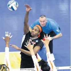  ?? CONTRIBUTE­D ?? Aiko Jones (third right) goes high to make a play during the Cardinals’ NCAA Sweet 16 match against Texas in Austin last December.