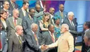  ?? PTI ?? PM Narendra Modi greets delegates at the African Developmen­t Bank annual meeting, in Gandhinaga­r, Gujarat on Tuesday.