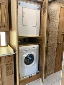  ?? ?? Most luxury motor homes have washers and dryers, like this pair in a coach for sale at Lazy Days RV in Seffner, Florida.