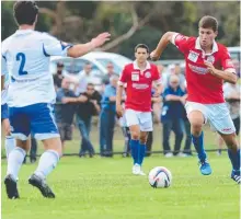  ??  ?? South’s Sheptim Mala challenges North’s Nikola Jurkovic.