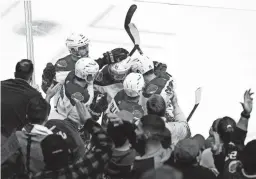  ?? REPUBLIC
ROB SCHUMACHER/THE ?? Right wing Clayton Keller and teammates celebrate his goal against the Blues in the first period at Gila River Arena on Oct. 18 in Glendale.