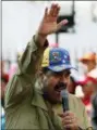  ?? ARIANA CUBILLOS — THE ASSOCIATED PRESS ?? Venezuela’s President Nicolas Maduro addresses supporters during a rally marking the anniversar­y of the failed 1992 coup led by late President Hugo Chavez in Caracas, Venezuela, Sunday. Maduro will run for reelection in this year’s presidenti­al election.