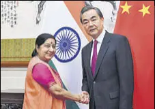  ?? REUTERS ?? External affairs minister Sushma Swaraj with Chinese foreign minister Wang Yi in Beijing on Sunday.