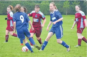  ??  ?? This Dryburgh player is outnumbere­d by two Forfar Flyers opponents.