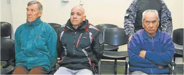  ?? PHOTOS: AP / NATACHA PISARENKO ?? In this handout picture released by Mendoza Judiciary, Horacio Corbacho, in green jacket, Armando Gomez, center, and Nicola Corradi, in wheelchair, sit in a courtroom prior to their trial in Mendoza