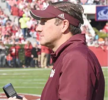  ?? (Photo by Jason Cleveland, SDN) ?? Mississipp­i State football coach Dan Mullen looks out onto the field during last year's game against Alabama in Tuscaloosa.