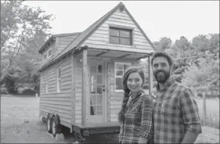  ?? TINY HOUSE EXPEDITION ?? Alexis Stephens and Christian Parsons have taken their tiny home across 27 states while working on a documentar­y about the tiny-home movement.